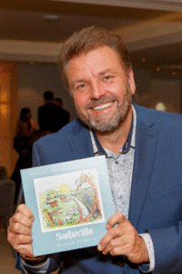 Martin Roberts with his Childrens book Sadsville in support of the NSPCC Basil Brush and Martin Roberts team up to help kids in lockdown